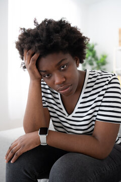 Sad African American woman looking at camera. Depression concept.