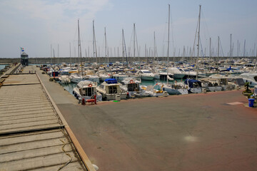 boats and yachts in the harbor of Lavagna, Liguria, Italy on a sunny day - obrazy, fototapety, plakaty