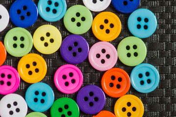 Colorful buttons background. Сlothing sewing in tailor shop