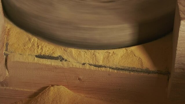 Working old water powered grist mill made of stones and wood, 4k