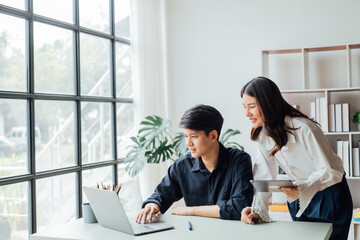 Fototapeta premium young husband and wife working at office by new project serious and happy