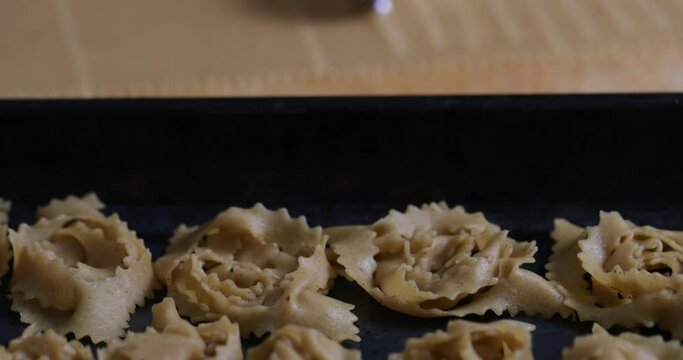 Experience the finesse of dough manipulation as expert hands transform chebakia into edible ar