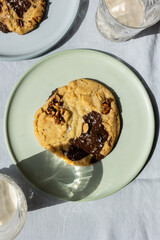 Chocolate Chip Cookie in Sunlight on Ceramic Plate