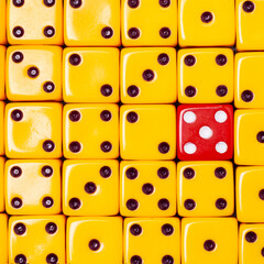 Yellow dice and one red dice. Clous-Up. Object of gambling, poker, and board games. Design