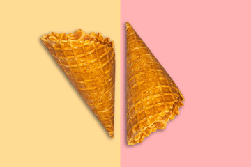 Ice cream cones on a pistachio pink background. Summer holiday concept. Food.