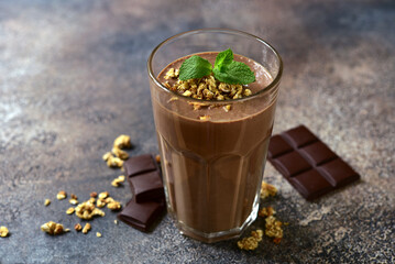 Delicious chocolate smoothie with mint and granola.