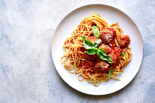 Pasta spaghetti with meat ball in tomato sauce . Top view.