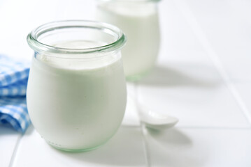 Obraz na płótnie Canvas Natural organic yogurt in a vintage glass jar.
