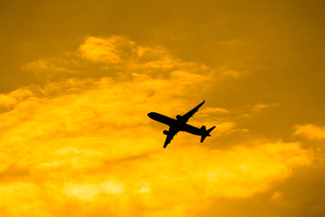 Naklejka premium Aircraft Passenger take off shot at sunset time