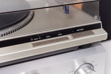 cropped view of vintage vinyl player and amplifier