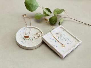 Jesmonite terrazzo stylish decorative trays with golden jewellery 