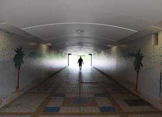 Person walking in the tunnel in Abu dhabi city