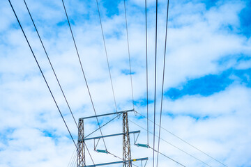 High voltage power pylon where the lines change direction.