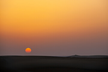 Sunset in Qatar desert.
