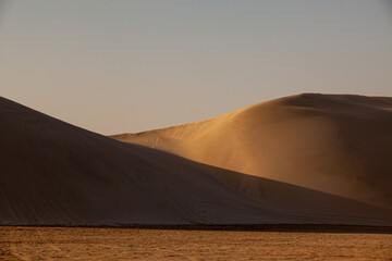 Naklejka na ściany i meble Sand dunes in desert in Qatar.