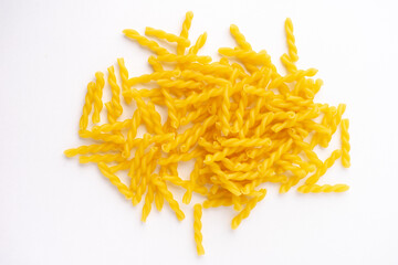 a heap of fusilli pasta isolated on white
