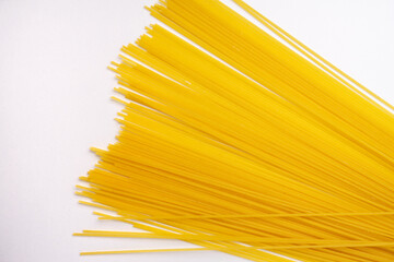 yellow long Italian spaghetti isolated on white
