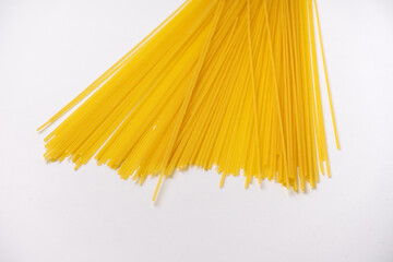 yellow long Italian spaghetti isolated on white