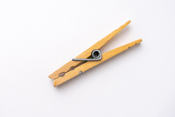 single isolated wooden clothespin