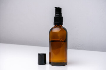 Brown glass cosmetic bottle isolated