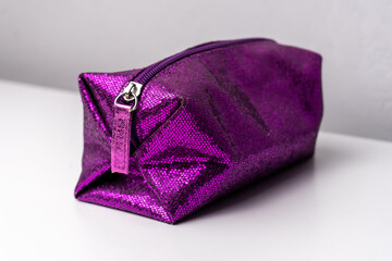 Glitter makeup bag isolated on white background