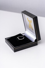 Silver ring and a black jewelry box