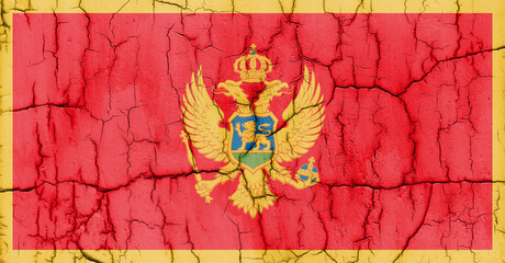 Flag of Montenegro on cracked wall, textured background.