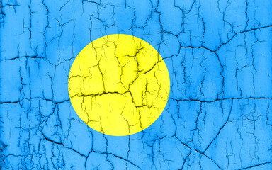 Flag of Palau on cracked wall, textured background.