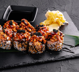 Sushi roll- gourmet fast food on black stone