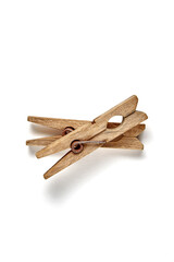 Two shabby vintage wooden clothespins isolated on a white background