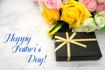 Yellow roses and gifts for Father's Day (marble background)