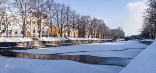 Chilling view of a frozen river in the town of Turku in Finland during winter