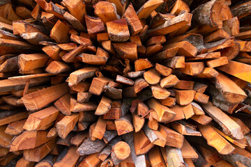 The pile of firewood prepared for winter, Pile firewood texture background. closeup of photo