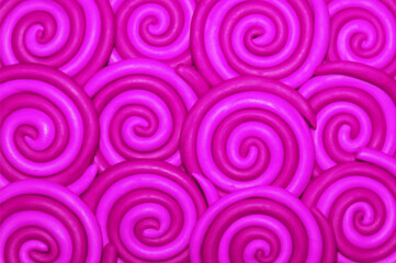 Obraz na płótnie Canvas Plasticine pink purple tone spiral circles background, being suitable for website, digital design or RGB work mode 