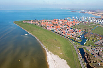 Fototapeta premium Aerial from the historical city Hindeloopen at the IJsselmeer in the Netherlands