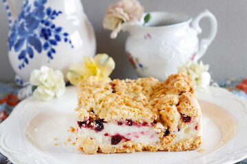 Homemade fruit cake with blueberries and red currant.