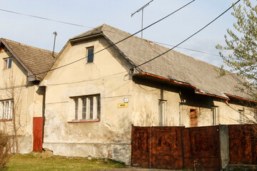 Fototapeta na wymiar LIESEK, SLOVAKIA - APRIL 30, 2022: Old houses by the road in Liesek, Slovakia.