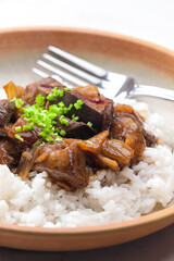Chinese beef meat with soy sauce served with rice