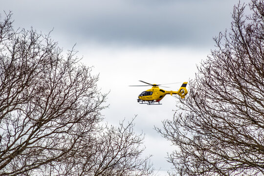 National Grid Yellow Electricity Helicopter In Action In Hampshire England