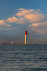 Fototapeta premium Phare de Chauvea near Ile de Re with ships to La Rochelle, Pays de la Loire, France