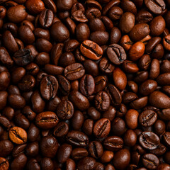 Background of roasted coffee beans. Macro photo. Free space for text. Top view.