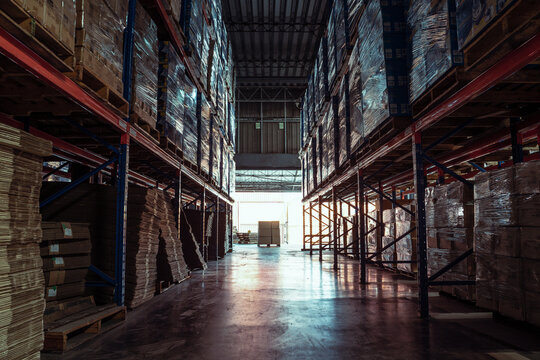 Warehouse or storage and shelves with cardboard boxes.