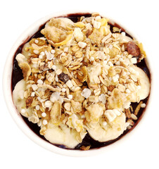 Bowl full of brazilian acai (acai), banana bars, granola and etc, isolated on the background