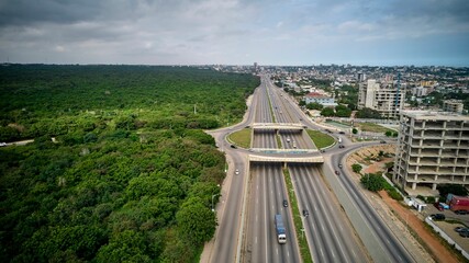 Bird's eye view of the Achimota forest with a highway traffic on roundabout