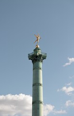 Fototapeta na wymiar Vertical shot of the Genie of Liberty monument located in Bastille Paris, France