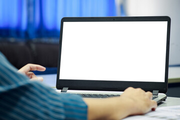 Notebook computer mockup with white blank screen for advertising text. Casual business man, freelancer hand using laptop computer at home office.