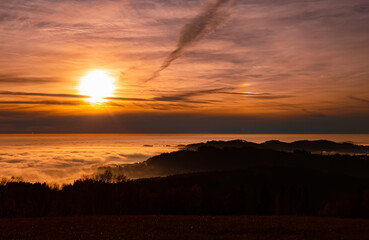 Autumn or indian summer sunset above the clouds near Kostenz, Bavarian forest, Bavaria, Germany