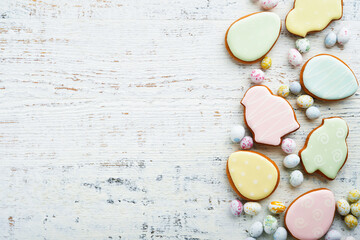 Easter homemade gingerbread rabbits, carrots, chickens and eggs icing cookies.  Festive holiday sweet food concept. Easter baking or decoration idea. White background, holiday concept with copy space