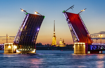 Fototapeta na wymiar Open Palace bridge and Peter and Paul fortress at summer night, St. Petersburg, Russia