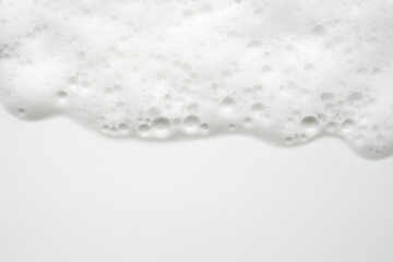Abstract white soap foam bubbles texture on white background - obrazy, fototapety, plakaty